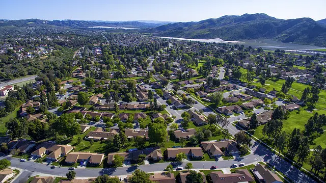 Aerial drone picture of a urban community close to mountains